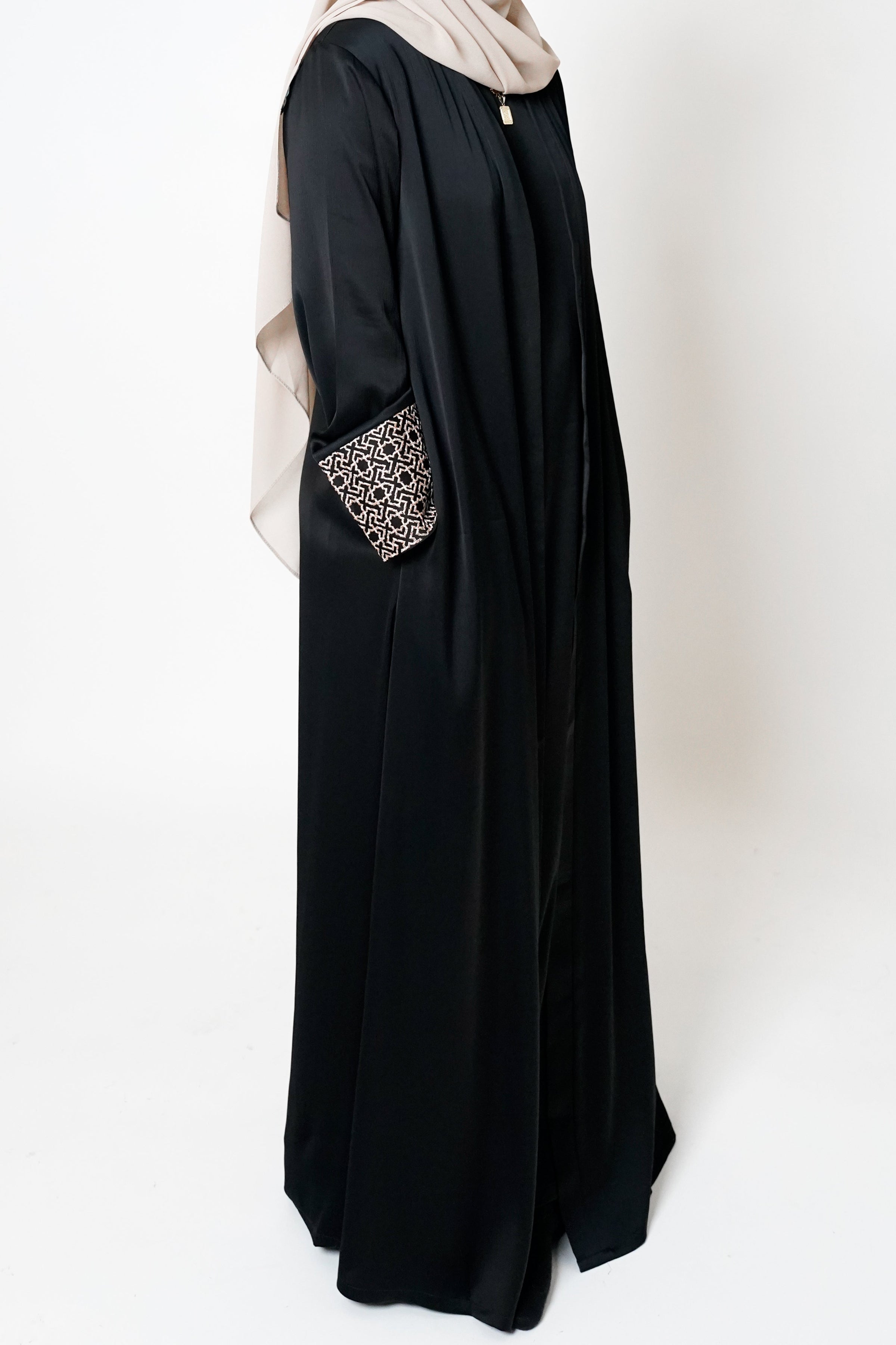 Black Geo Embroidered Cuff Open Abaya featuring a geometric embroidered print on the cuffs, offering sophistication and elevating modest style with an exclusive design