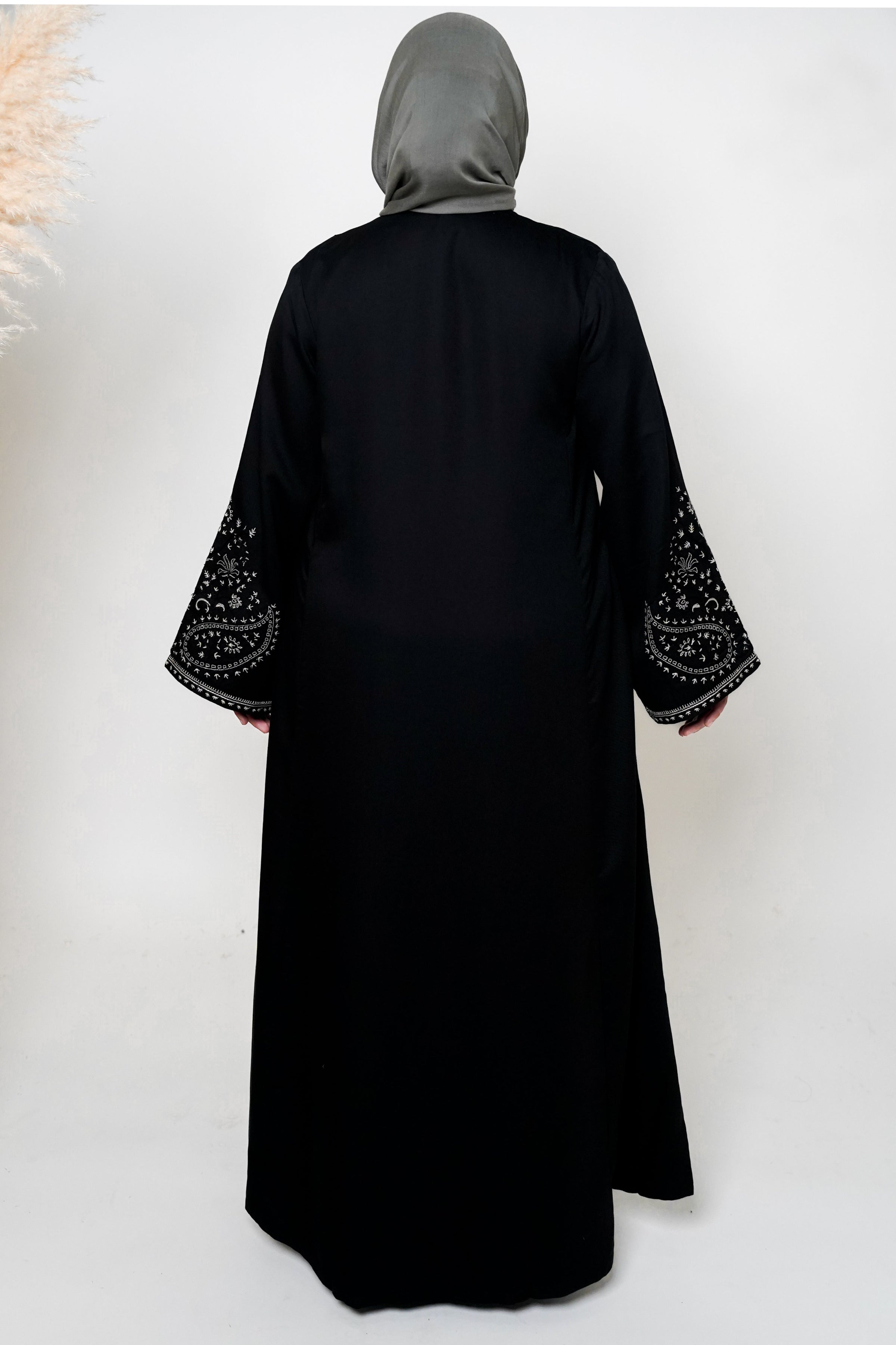 Black & White Embroidered Open Abaya featuring intricate black and white embroidery on a classic open design, offering a timeless and luxurious look. Perfect for both formal and casual outfits.