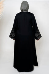 Black & White Embroidered Open Abaya featuring intricate black and white embroidery on a classic open design, offering a timeless and luxurious look. Perfect for both formal and casual outfits.