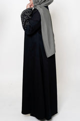 Black & White Embroidered Open Abaya featuring intricate black and white embroidery on a classic open design, offering a timeless and luxurious look. Perfect for both formal and casual outfits.