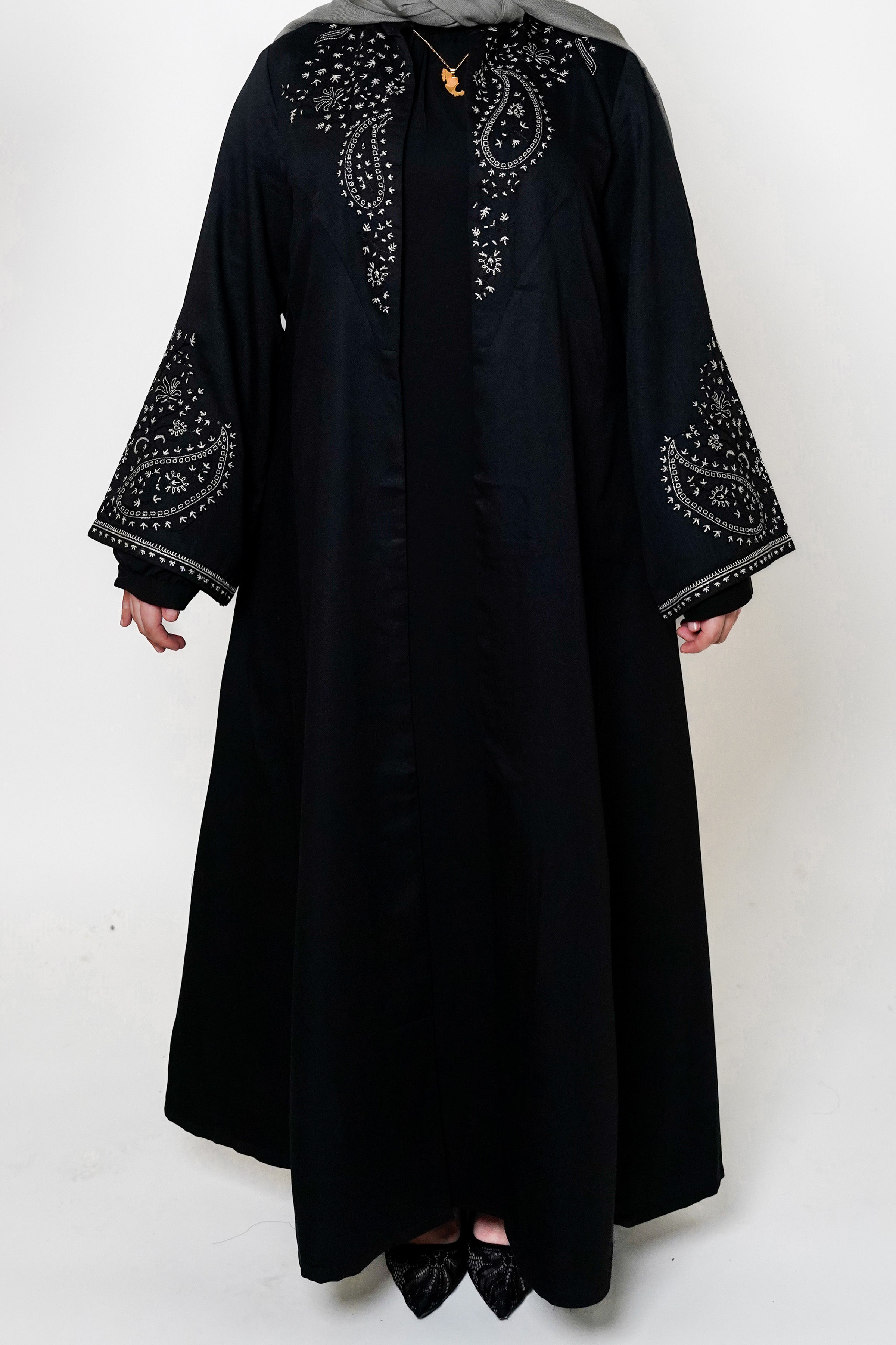Black & White Open Abaya featuring intricate black and white embroidery on a classic open design, offering a timeless and luxurious look. Perfect for both formal and casual outfits.