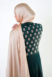 an elegant emerald green kimono with intricate floral embroidery on the back. The kimono has long sleeves.