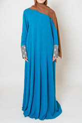 Luxury Caspian Blue Embroidered Cuff Abaya – Indulge in the opulent elegance of our Luxury Caspian Blue Abaya, featuring intricate embroidery on the cuffs that adds sophistication. Crafted in a soft fabric with panels for a rich and full flow, offering ultimate comfort.