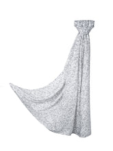 Sacred Script Bamboo Modal Hijab in a soft white color featuring a delicate abstract pattern in shades of gray, offering a subtle and elegant design.