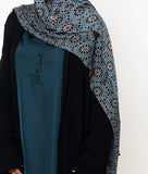 Fezaic Bamboo Modal Hijab featuring a mosaic tile print inspired by the colors of Morocco, with intricate patterns in blue, black, and earthy tones.