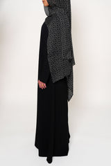 Geo Black Bamboo Modal Hijab in black featuring a modern geometric pattern in white, offering a sleek and stylish design that blends elegance with contemporary appeal.
