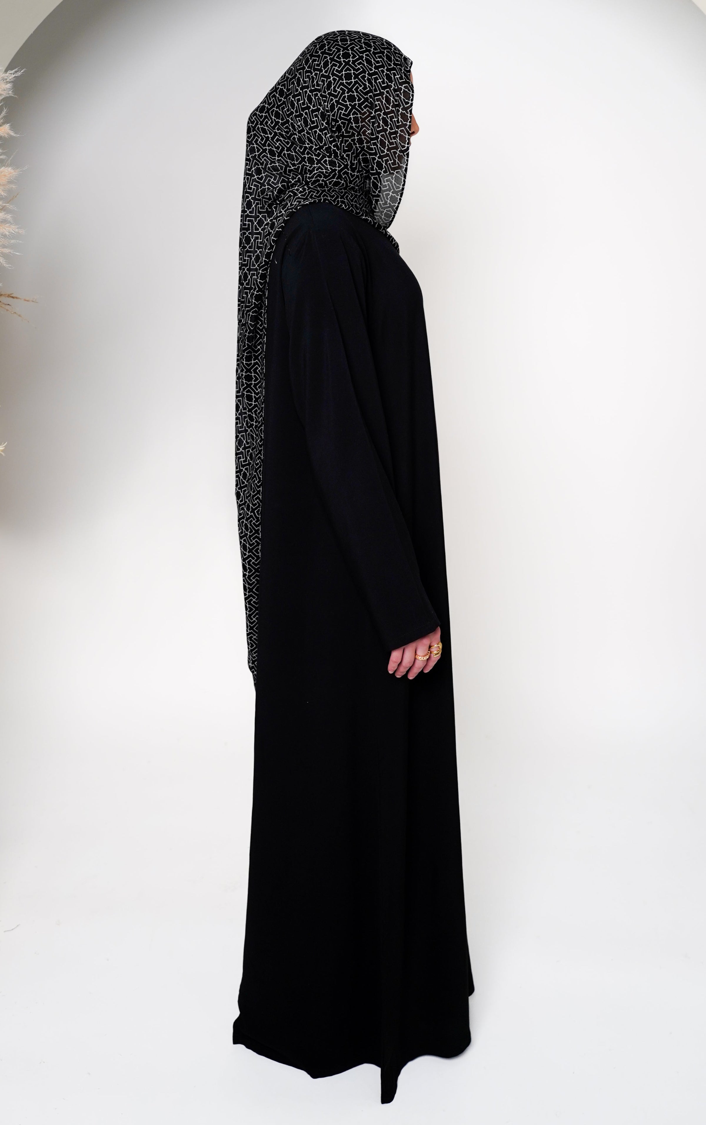 Geo Black Bamboo Modal Hijab in black featuring a modern geometric pattern in white, offering a sleek and stylish design that blends elegance with contemporary appeal.