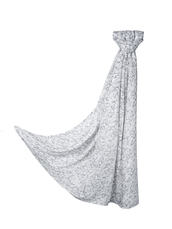 Sacred Script Bamboo Modal Hijab in a soft white color featuring a delicate abstract pattern in shades of gray, offering a subtle and elegant design.