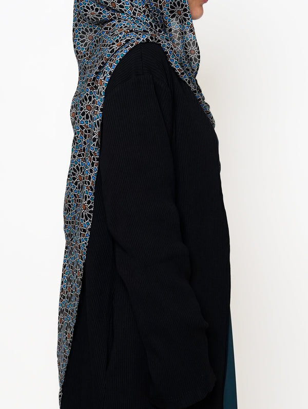 Fezaic Bamboo Modal Hijab featuring a mosaic tile print inspired by the colors of Morocco, with intricate patterns in blue, black, and earthy tones.